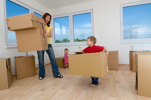 Local moving team handling boxes and furniture in Dalston