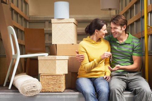 Packed moving boxes and furniture ready for removals in Dalston